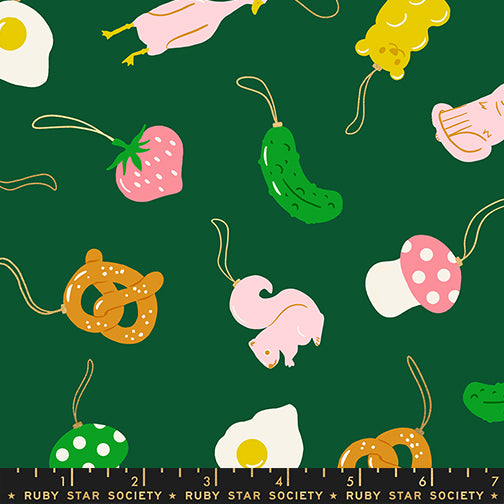 Pattern of food items on a green background with a ruler at the bottom.
