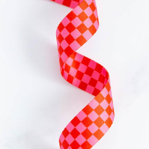 Checkered webbing in red and pink on a white background