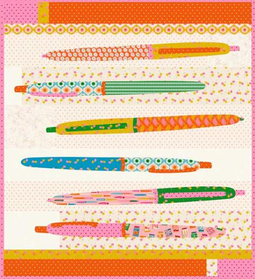 Colorful pens arranged on a patterned background