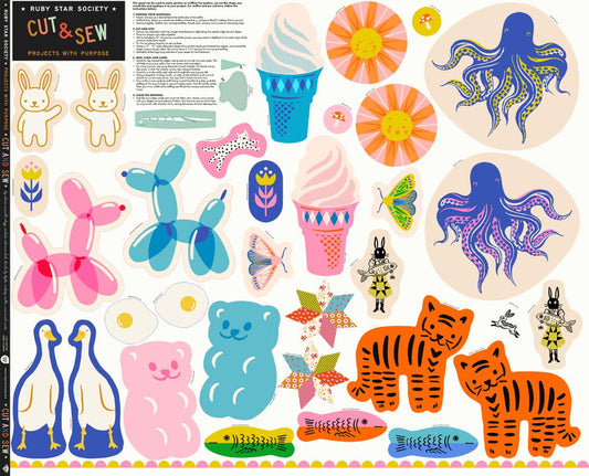 Colorful cut-out craft items including animals, ice cream cones, and flowers on a white background.